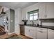 A modern kitchen featuring stainless steel appliances, granite countertops, and ample cabinet space at 1924 Pompano Dr., Garden City Beach, SC 29576