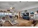 Inviting living room with hardwood floors, ceiling fan, and views of the waterway from the back at 1924 Pompano Dr., Garden City Beach, SC 29576