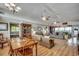 Spacious living room featuring hardwood floors, ceiling fans, and comfortable furniture at 1924 Pompano Dr., Garden City Beach, SC 29576