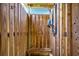 Private wooden outdoor shower stall with a mounted shower head and bench seating at 1924 Pompano Dr., Garden City Beach, SC 29576