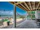 Covered patio area with a hammock and scenic waterfront views at 1924 Pompano Dr., Garden City Beach, SC 29576