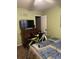 Bedroom featuring green walls and a chest of drawers topped with a television at 2005 Greens Blvd. # F-205, Myrtle Beach, SC 29577