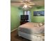 Bedroom featuring a comfortable bed, neutral carpet, and a TV on a wooden console at 2005 Greens Blvd. # F-205, Myrtle Beach, SC 29577