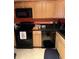 Well-equipped kitchen featuring modern appliances and ample cabinet space at 2005 Greens Blvd. # F-205, Myrtle Beach, SC 29577