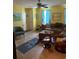 Comfortable living room with tile floors, a sectional sofa, and natural light from the window at 2005 Greens Blvd. # F-205, Myrtle Beach, SC 29577