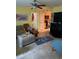 Cozy living room featuring tile floors, comfortable furniture, and an open doorway to the kitchen at 2005 Greens Blvd. # F-205, Myrtle Beach, SC 29577