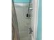 Neat shower with attached caddy, hand-held sprayer, shelves, and a blue accent wall at 2005 Greens Blvd. # F-205, Myrtle Beach, SC 29577