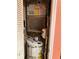 Utility closet with water heater, HVAC unit, and storage space at 2005 Greens Blvd. # F-205, Myrtle Beach, SC 29577