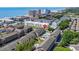Aerial shot of condos with ocean views, pools, landscaping, and a glimpse of the nearby marshland at 202 Maison Dr. # L-301, Myrtle Beach, SC 29572