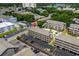Aerial view of condo complex showing mature trees, swimming pool and golf course in the background at 202 Maison Dr. # L-301, Myrtle Beach, SC 29572