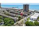 A scenic aerial view of a condo complex with beach access, a pier, and ocean views at 202 Maison Dr. # L-301, Myrtle Beach, SC 29572