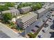An aerial view of a condominium complex with manicured landscaping, parking, and a shared pool area at 202 Maison Dr. # L-301, Myrtle Beach, SC 29572