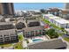 Aerial view of condo community with pool and distant ocean views, plus surrounding amenities at 202 Maison Dr. # L-301, Myrtle Beach, SC 29572