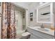Bathroom featuring a vanity, seashell art and a tub with shower and decorative curtain at 202 Maison Dr. # L-301, Myrtle Beach, SC 29572
