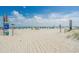 Expansive beach with soft sand, blue skies, and ocean views in a coastal community at 202 Maison Dr. # L-301, Myrtle Beach, SC 29572
