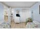 Twin bedroom with light blue walls, beach themed decor, and easy access to the living area at 202 Maison Dr. # L-301, Myrtle Beach, SC 29572