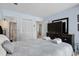 Bright bedroom featuring light blue walls, television, closet and access to the bathroom at 202 Maison Dr. # L-301, Myrtle Beach, SC 29572