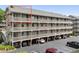 An angled exterior shot of a beach condo resort with a multi-level deck and parking beneath at 202 Maison Dr. # L-301, Myrtle Beach, SC 29572