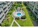 Aerial view of community hot tub with seating and landscaping located within the condo complex at 202 Maison Dr. # L-301, Myrtle Beach, SC 29572