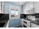 Well-equipped kitchen with ample cabinets, stone countertops, and modern appliances at 202 Maison Dr. # L-301, Myrtle Beach, SC 29572