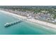 Stunning aerial panorama capturing a pier, beach, and oceanfront community at 212 Millwood Dr., Surfside Beach, SC 29575
