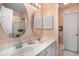 Bathroom featuring double sinks, mirrors, shower and a closed door at 212 Millwood Dr., Surfside Beach, SC 29575