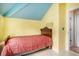 Small bedroom featuring a bed, light wood floors, and pale yellow walls at 212 Millwood Dr., Surfside Beach, SC 29575