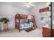 Bedroom featuring a bunk bed, a small plant and a dresser by the window at 212 Millwood Dr., Surfside Beach, SC 29575
