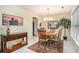 Bright dining room featuring a round table, decorative lighting, and stylish furnishings at 212 Millwood Dr., Surfside Beach, SC 29575