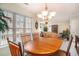 Bright dining area featuring a wood table, chandelier, and large window with views at 212 Millwood Dr., Surfside Beach, SC 29575