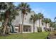Inviting exterior with palm trees, stairs, and elevated construction for coastal living at 212 Millwood Dr., Surfside Beach, SC 29575