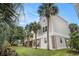 Charming exterior with palm trees, two stories, and brick accents offering a coastal vibe at 212 Millwood Dr., Surfside Beach, SC 29575