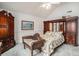 Spacious bedroom with dark wood furniture and a vaulted ceiling with fan at 212 Millwood Dr., Surfside Beach, SC 29575