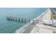 Picturesque aerial view of a scenic pier and sandy beach with blue waters at 212 Millwood Dr., Surfside Beach, SC 29575
