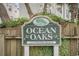 Community sign reads Ocean Oaks at Surfside Beach amidst lush greenery at 212 Millwood Dr., Surfside Beach, SC 29575