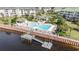 Community pool and entertainment area with plenty of chairs and a stunning dock on the water at 2180 Waterview Dr. # 725, North Myrtle Beach, SC 29582