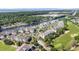 Aerial view of community buildings, golf course, and a waterway with a view of the ocean in the distance at 2180 Waterview Dr. # 725, North Myrtle Beach, SC 29582