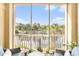 Relaxing screened-in balcony with wicker furniture and views of the river and trees at 2180 Waterview Dr. # 725, North Myrtle Beach, SC 29582
