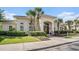 Attractive clubhouse with tidy landscaping, featuring palm trees and flowering shrubs at 2180 Waterview Dr. # 725, North Myrtle Beach, SC 29582
