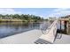 Dock featuring metal railings and stairs leading down to the water and a ladder at 2180 Waterview Dr. # 725, North Myrtle Beach, SC 29582