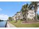 Exterior of building with balconies overlooking a waterway and lush landscaping at 2180 Waterview Dr. # 725, North Myrtle Beach, SC 29582