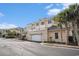Well maintained building featuring a garage, patio, palm trees, and attractive architecture at 2180 Waterview Dr. # 725, North Myrtle Beach, SC 29582