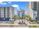 View of beachfront building and parking area, with palm trees and neatly arranged parking at 2180 Waterview Dr. # 725, North Myrtle Beach, SC 29582