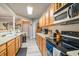 Bright kitchen features wood cabinets, modern appliances, and an open layout perfect for cooking and entertaining at 2180 Waterview Dr. # 725, North Myrtle Beach, SC 29582