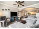 Spacious living room with modern furniture, television, and open layout connecting to dining and kitchen areas at 2180 Waterview Dr. # 725, North Myrtle Beach, SC 29582