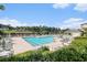 Beautiful outdoor pool with lounge chairs and umbrellas overlooking the waterway and landscaping at 2180 Waterview Dr. # 725, North Myrtle Beach, SC 29582