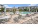 Relaxing pool area featuring lounge chairs and a building with tiled roof and columns at 2180 Waterview Dr. # 725, North Myrtle Beach, SC 29582