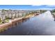 Buildings on waterway with retaining wall, landscaping, and mature palm trees at 2180 Waterview Dr. # 725, North Myrtle Beach, SC 29582