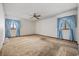 Bedroom featuring carpet floors, patterned walls and ceiling fan at 219 Caropine Dr., Surfside Beach, SC 29575