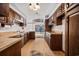 A kitchen with wood cabinets, laminate countertops, and geometric tile flooring at 219 Caropine Dr., Surfside Beach, SC 29575